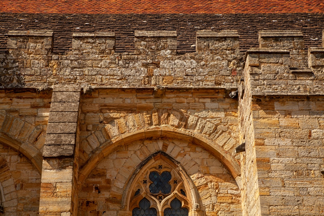 brown brick building with brown wooden door