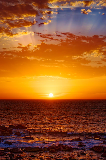 body of water during sunset