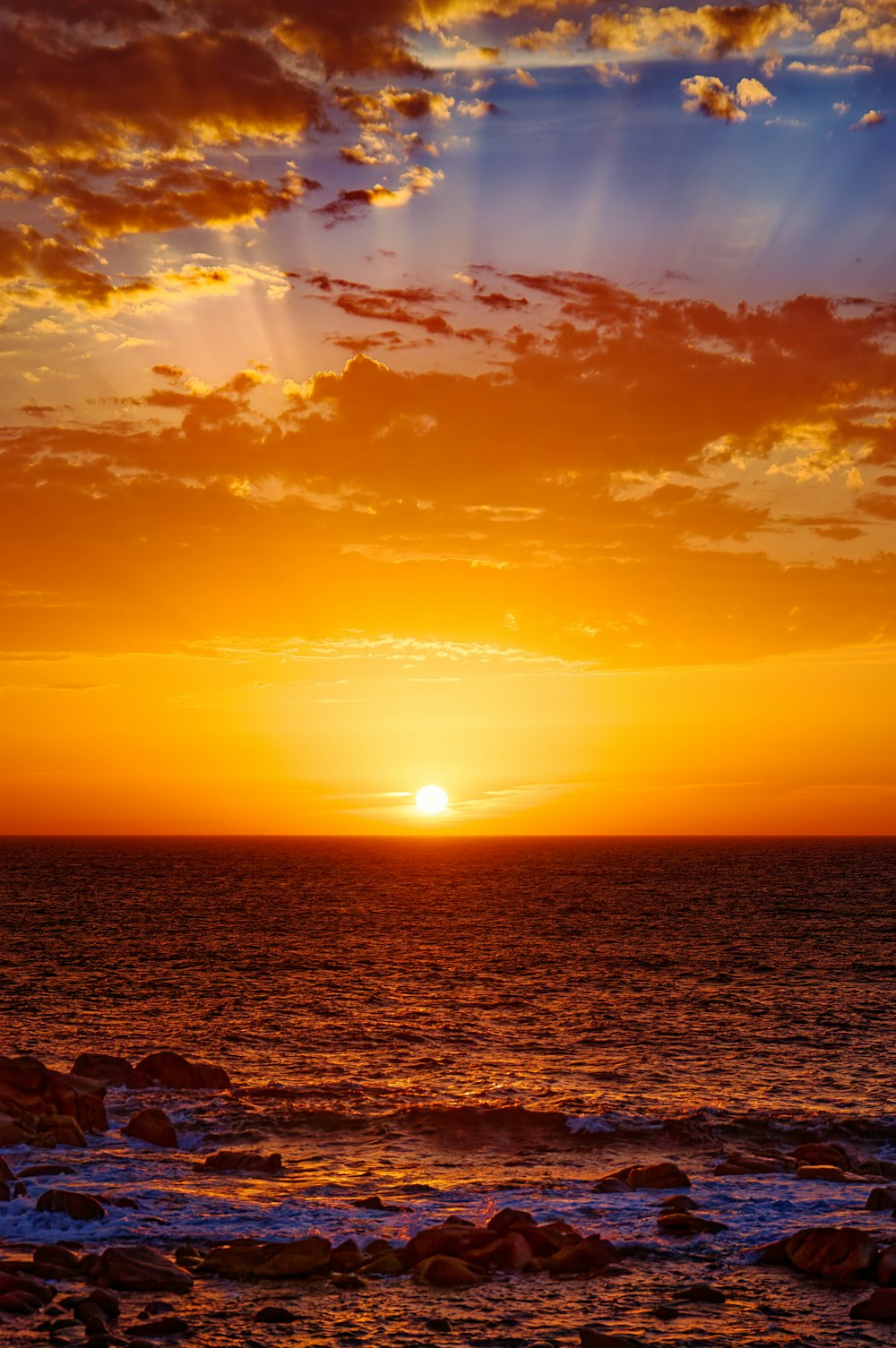 body of water during sunset