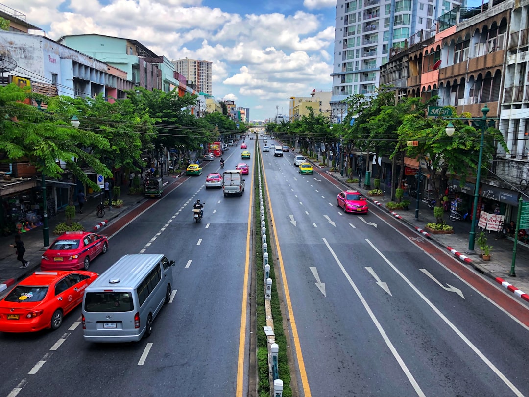 cars on road near buildings during daytime