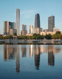 city skyline near body of water during daytime