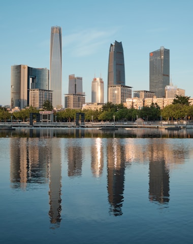 city skyline near body of water during daytime