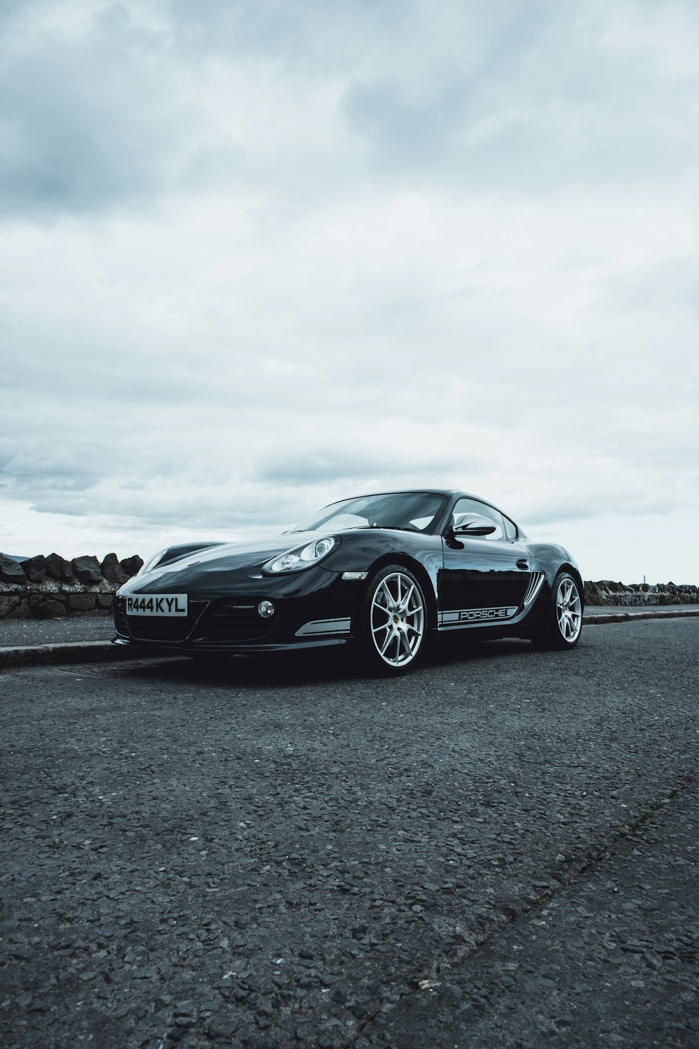 black porsche 911 on beach during daytime