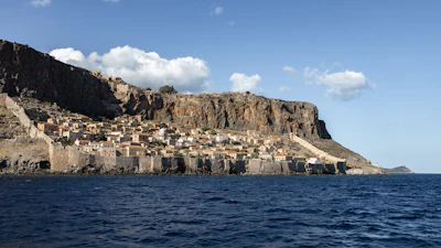 The rock of Monemvasia rising out of the sea, its town along the base