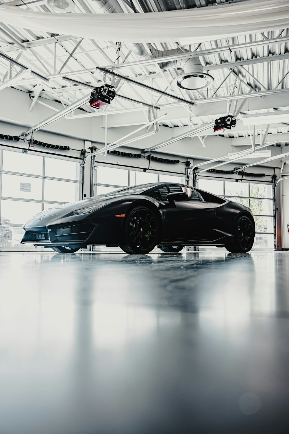 black coupe in a white room