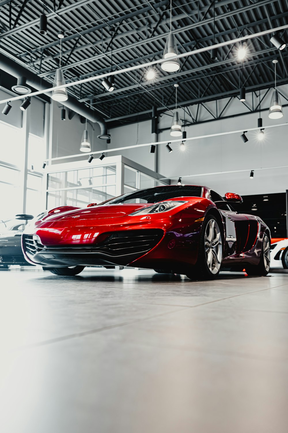 red ferrari 458 italia on white floor