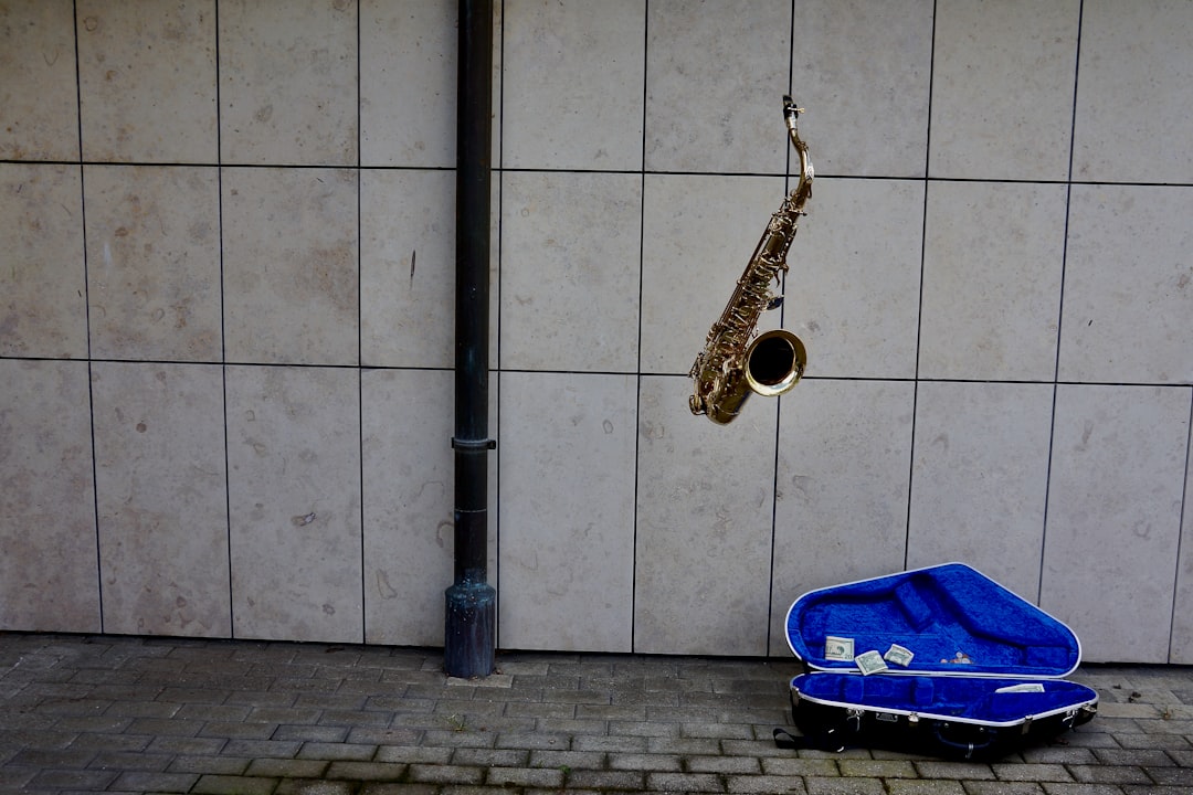 gold saxophone on blue case