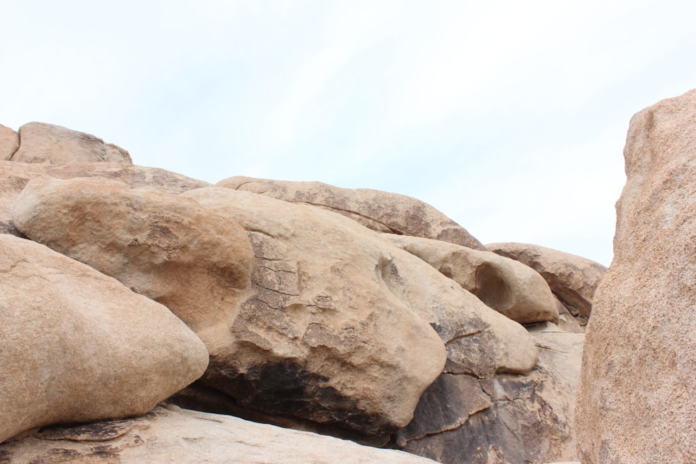 brown rock formation under white sky during daytime