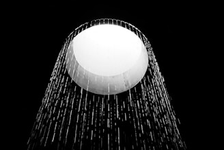 white round light on black surface
