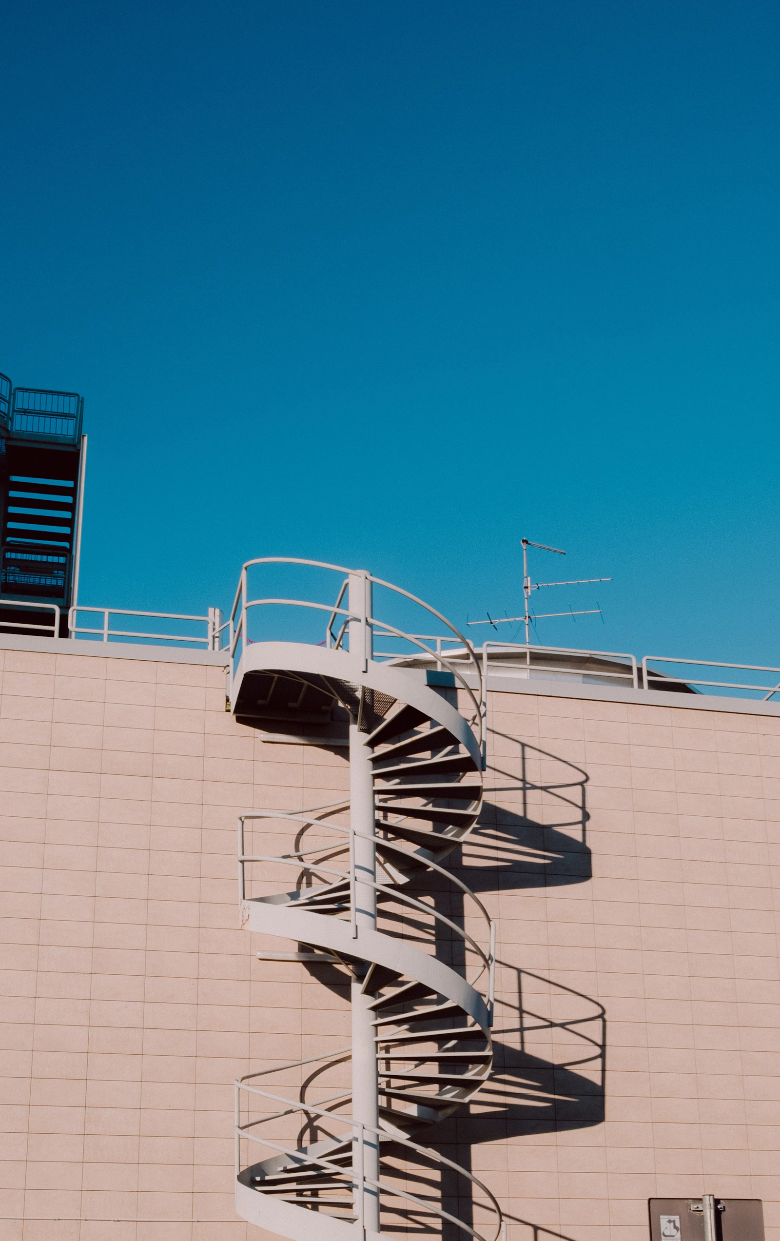 Sculptural white architecture rising against a blue sky