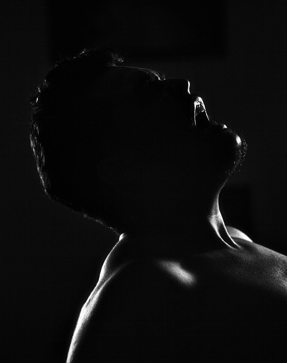 grayscale photo of topless man