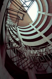 white and brown spiral staircase