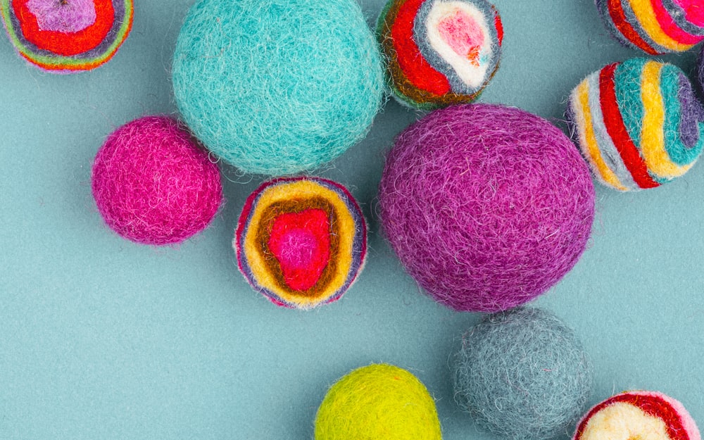 multi colored eggs on white surface