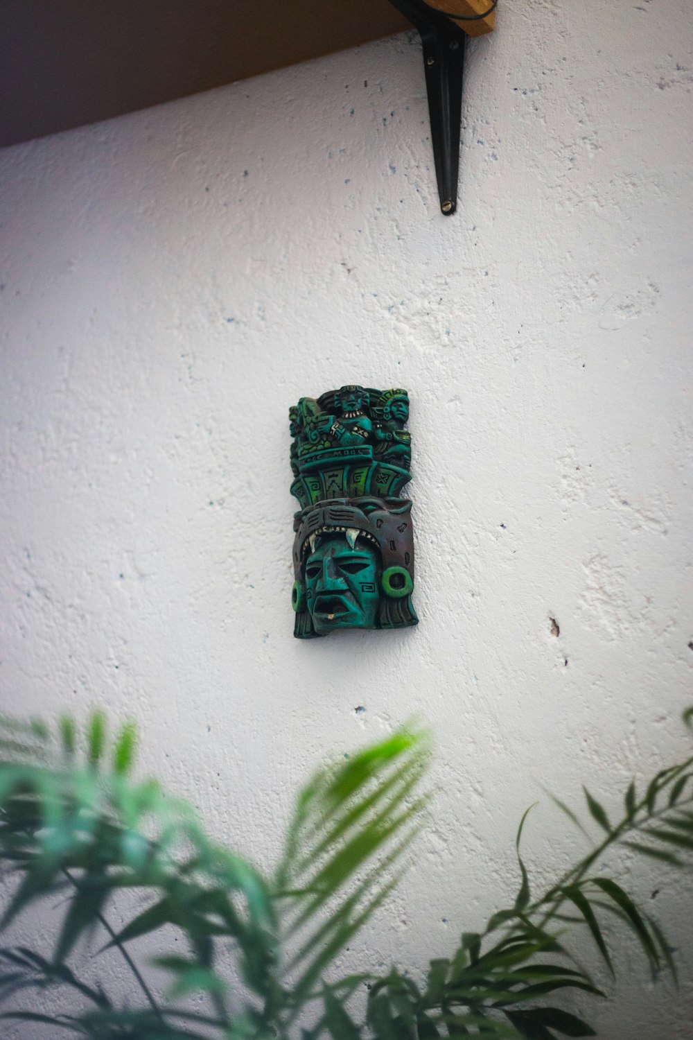 green and brown wooden wall mounted decor