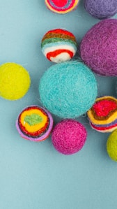 multi colored eggs on white surface