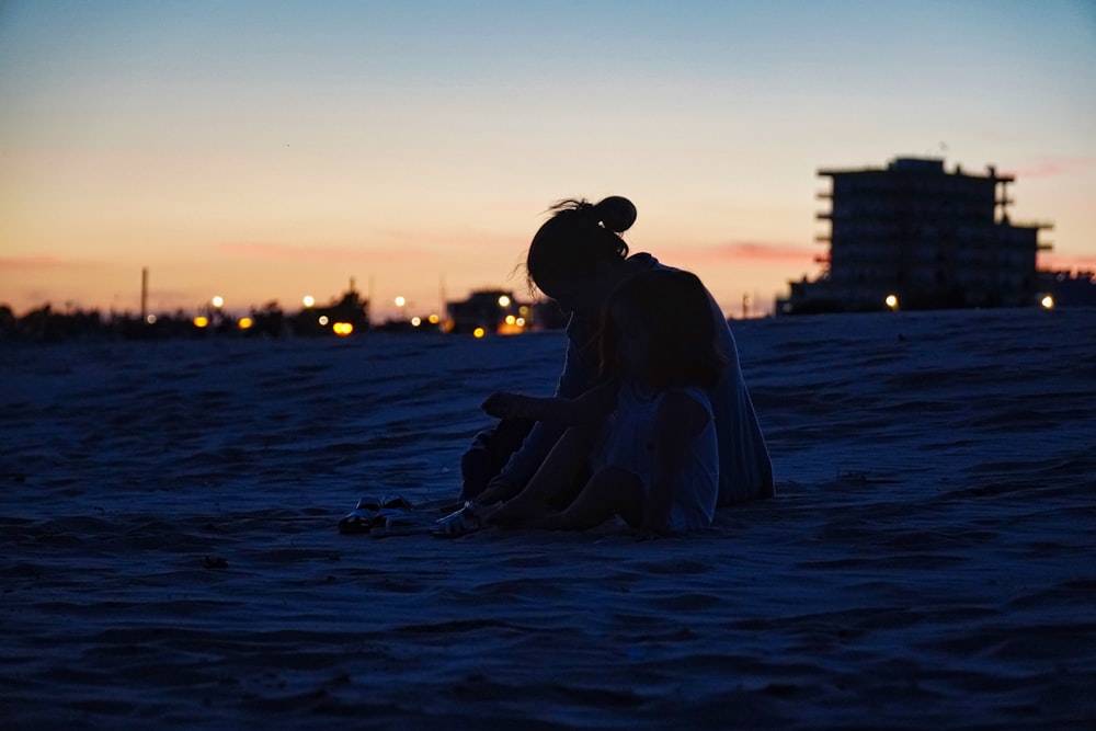 woman in white dress sitting on water during sunset