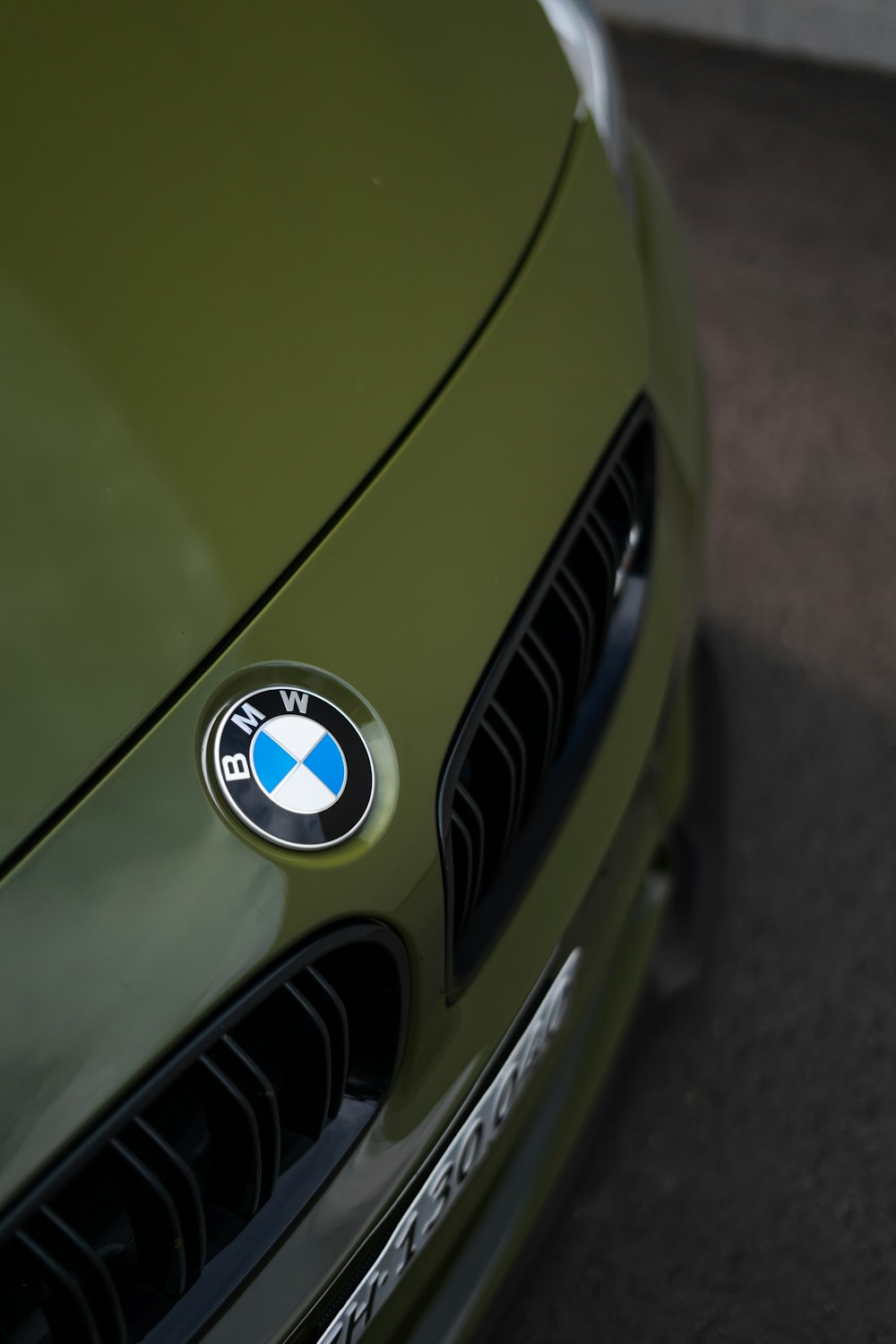 green bmw car with white and green logo