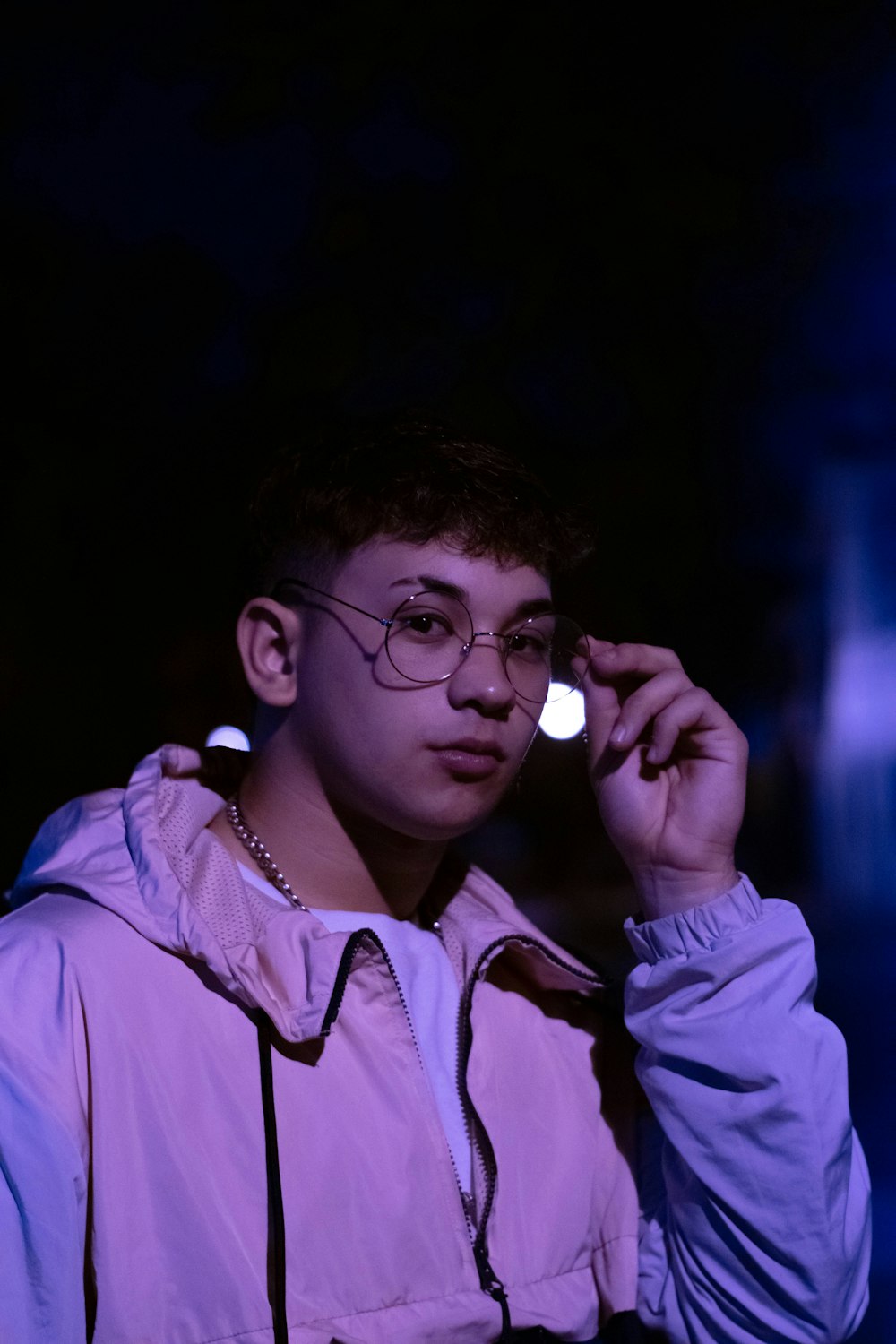 woman in pink dress shirt wearing eyeglasses