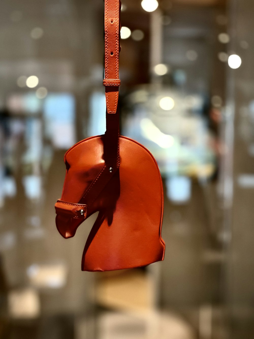 red leather bag in close up photography