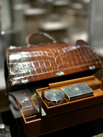 Leather travel cigar case open to reveal neatly arranged cigars inside.