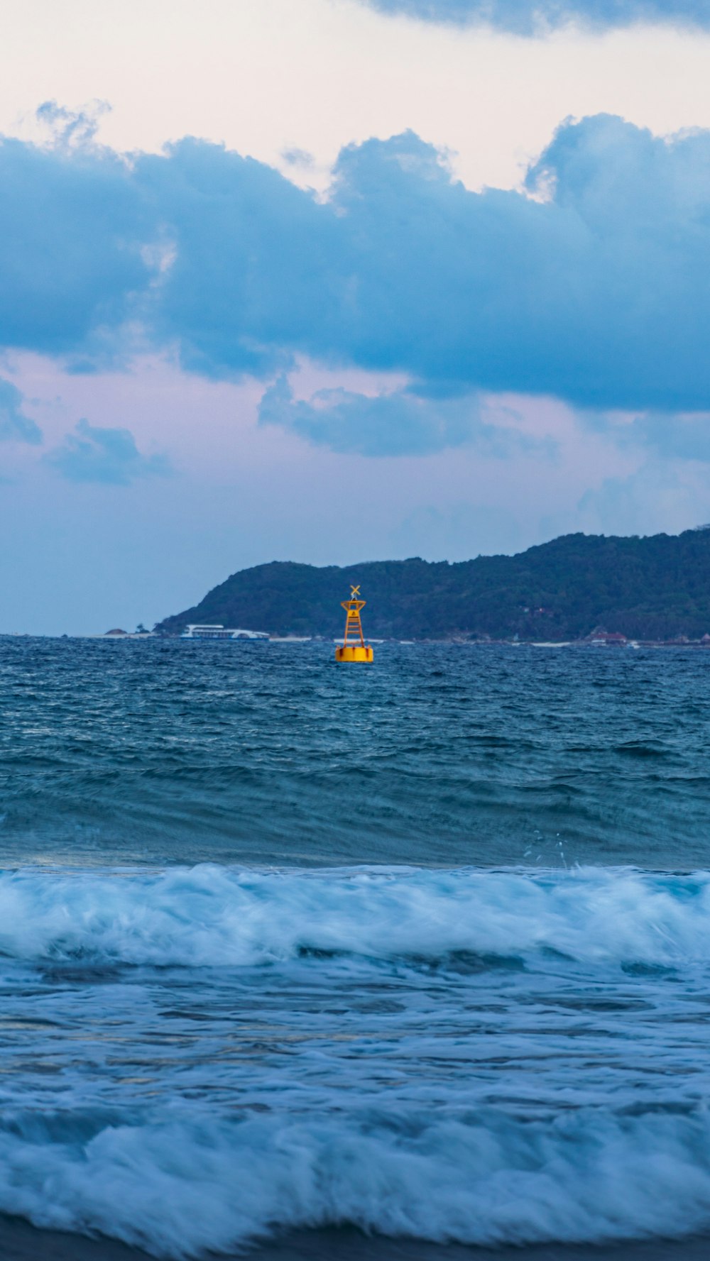 person in yellow shirt riding yellow kayak on sea during daytime