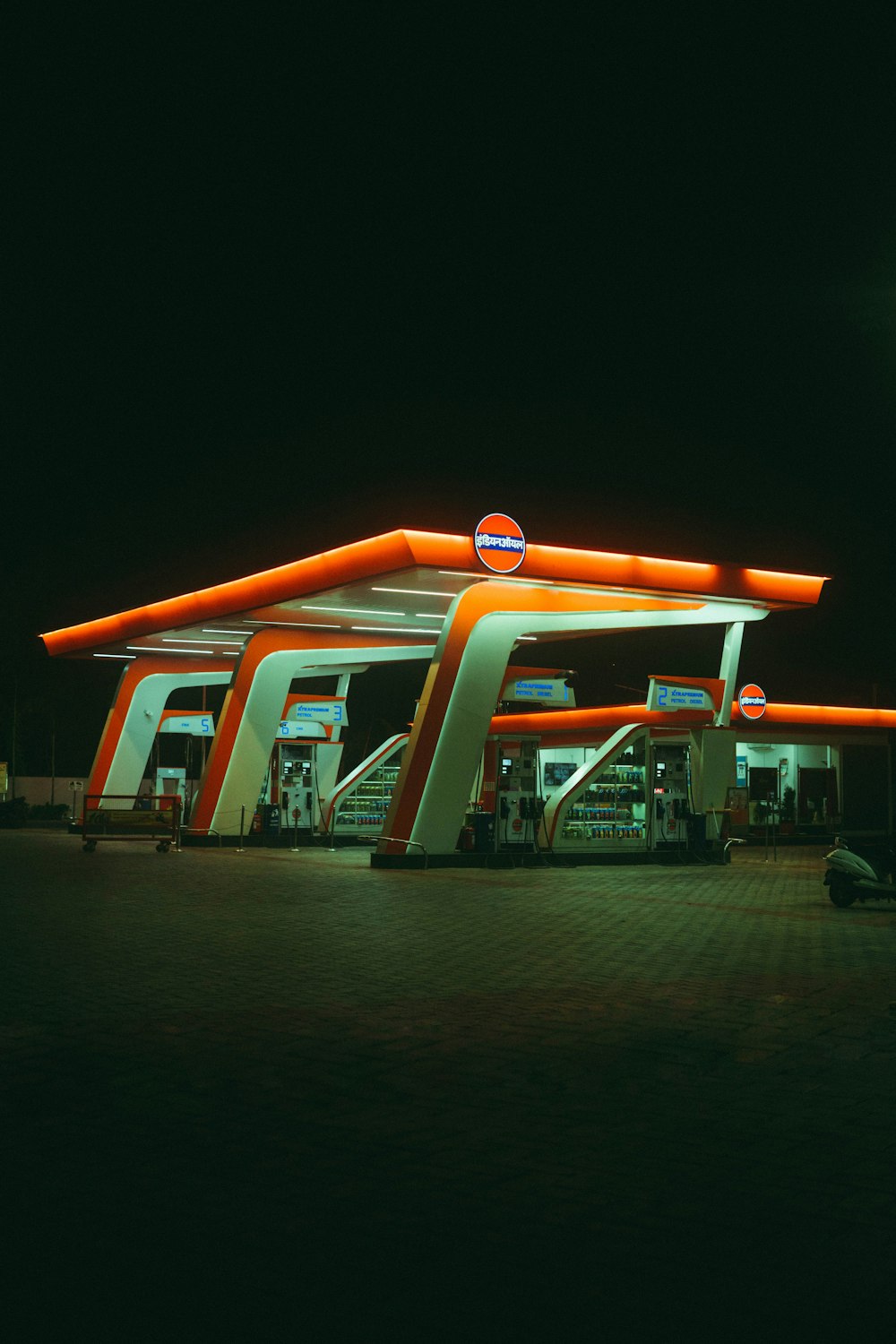 orange and white bus on the road during night time