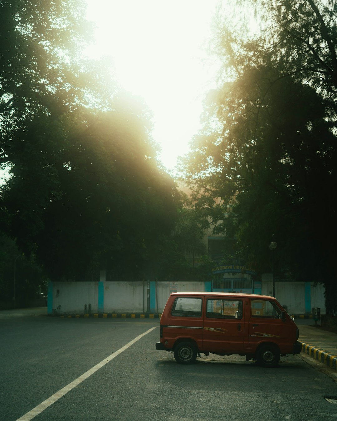 red van on road during daytime