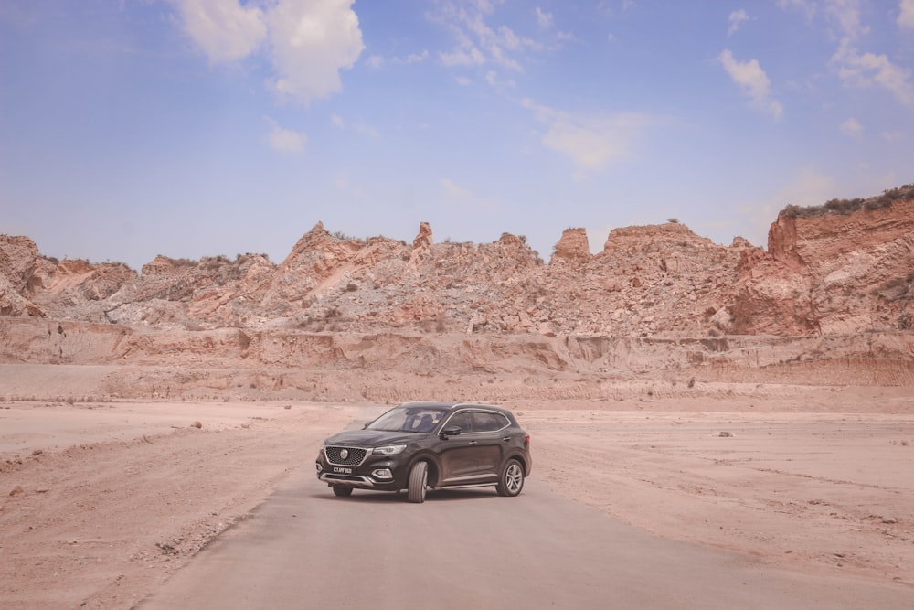 black suv on brown sand