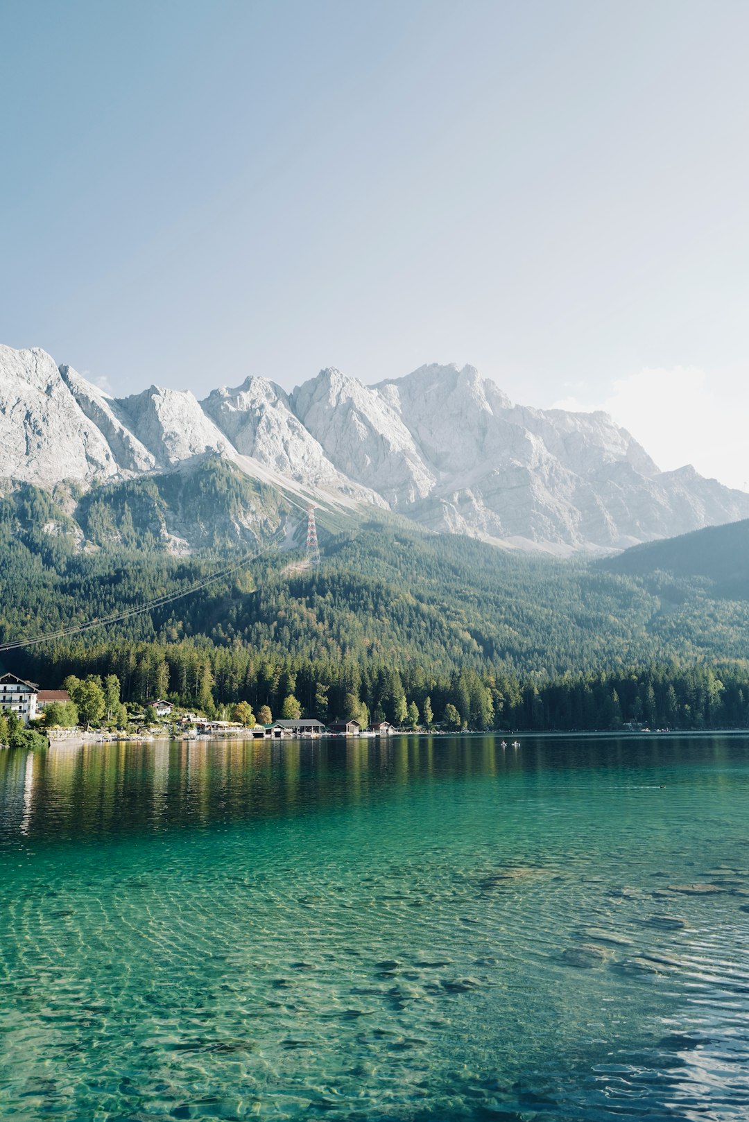 green lake near mountain during daytime