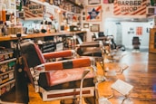 The barbershop interior featuring vintage barber chairs and hair styling products neatly arranged.