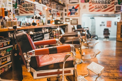 Barber shop interior featuring classic chairs and vintage decor.