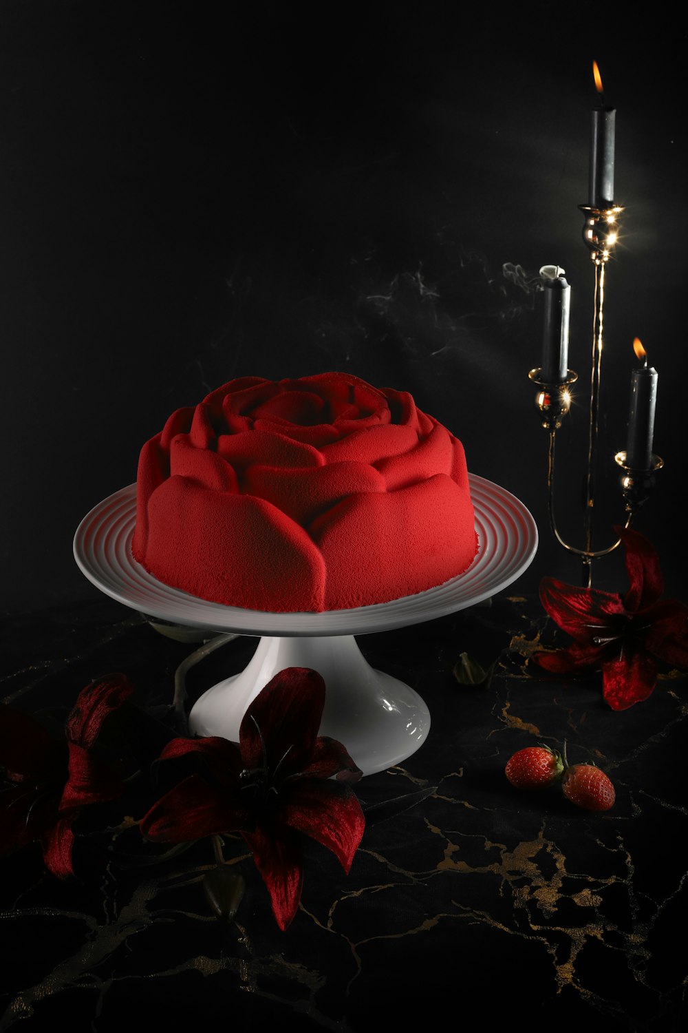 red cake on white cake stand