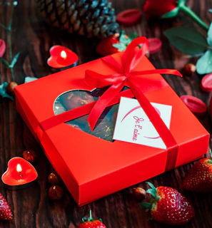 A creative gift box filled with personalized items, captured during a heartfelt delivery.