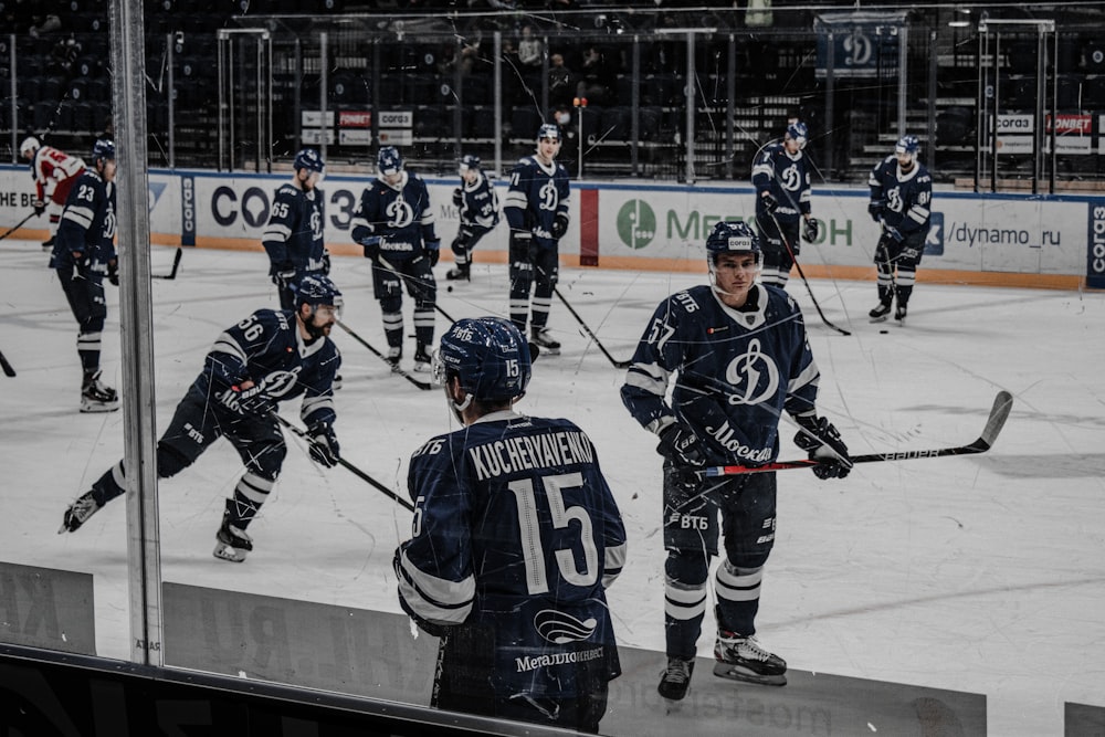 2 men playing ice hockey