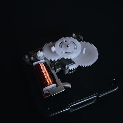 Close-up of a mechanic rewinding an electric motor coil with precision.