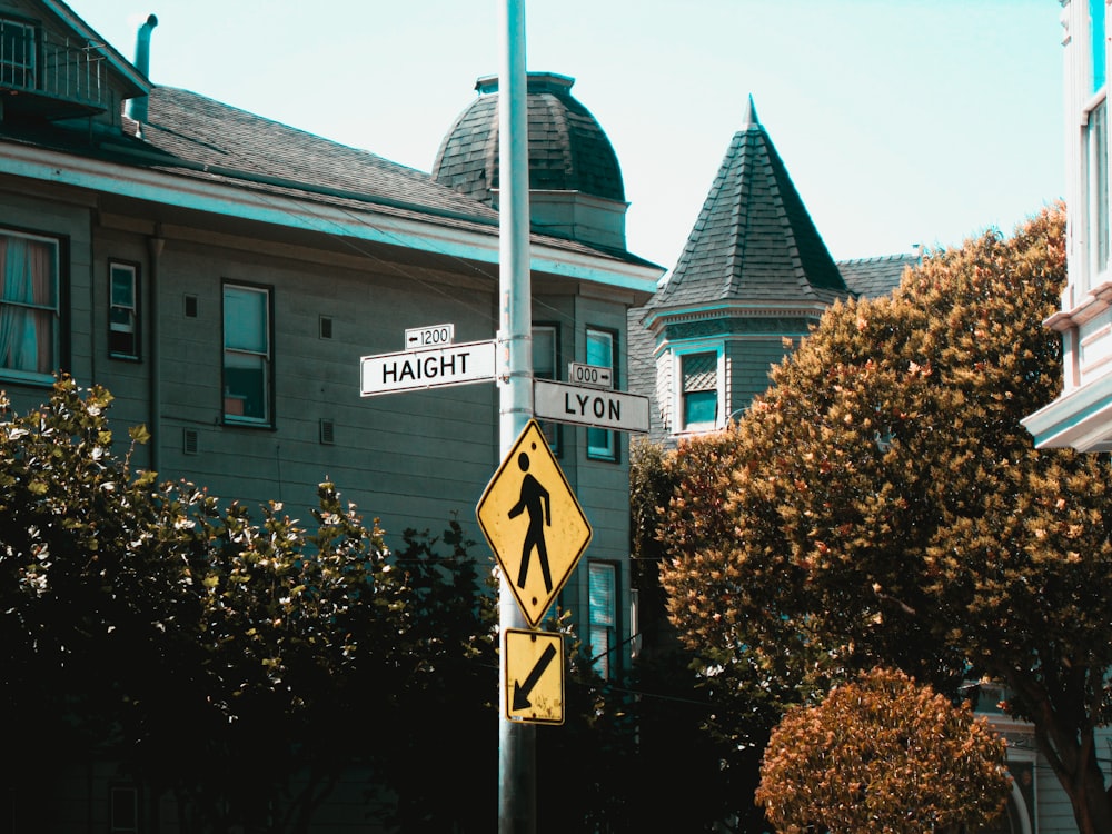 white and brown house with white arrow sign