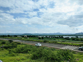 white car on road during daytime