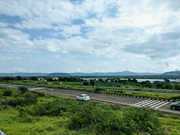 white car on road during daytime