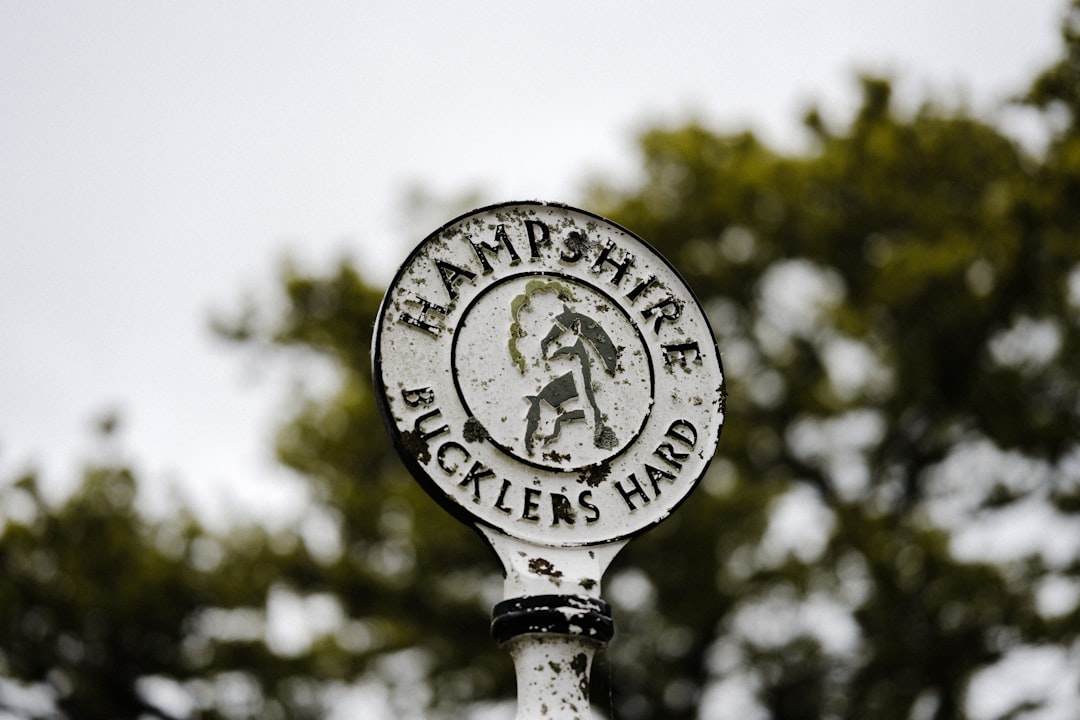 white and black round street sign