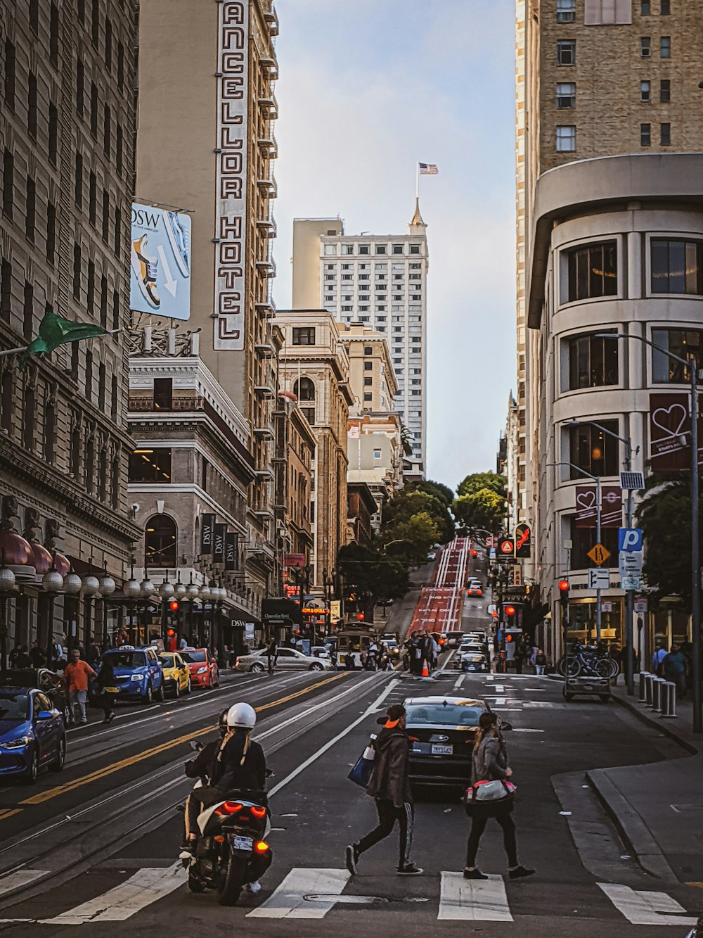 a couple of people that are standing in the street