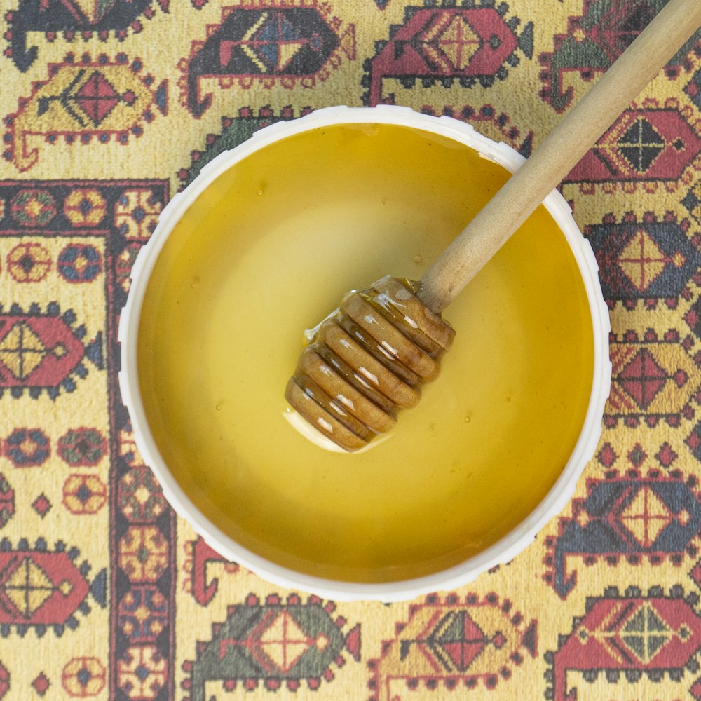 yellow ceramic bowl with silver fork