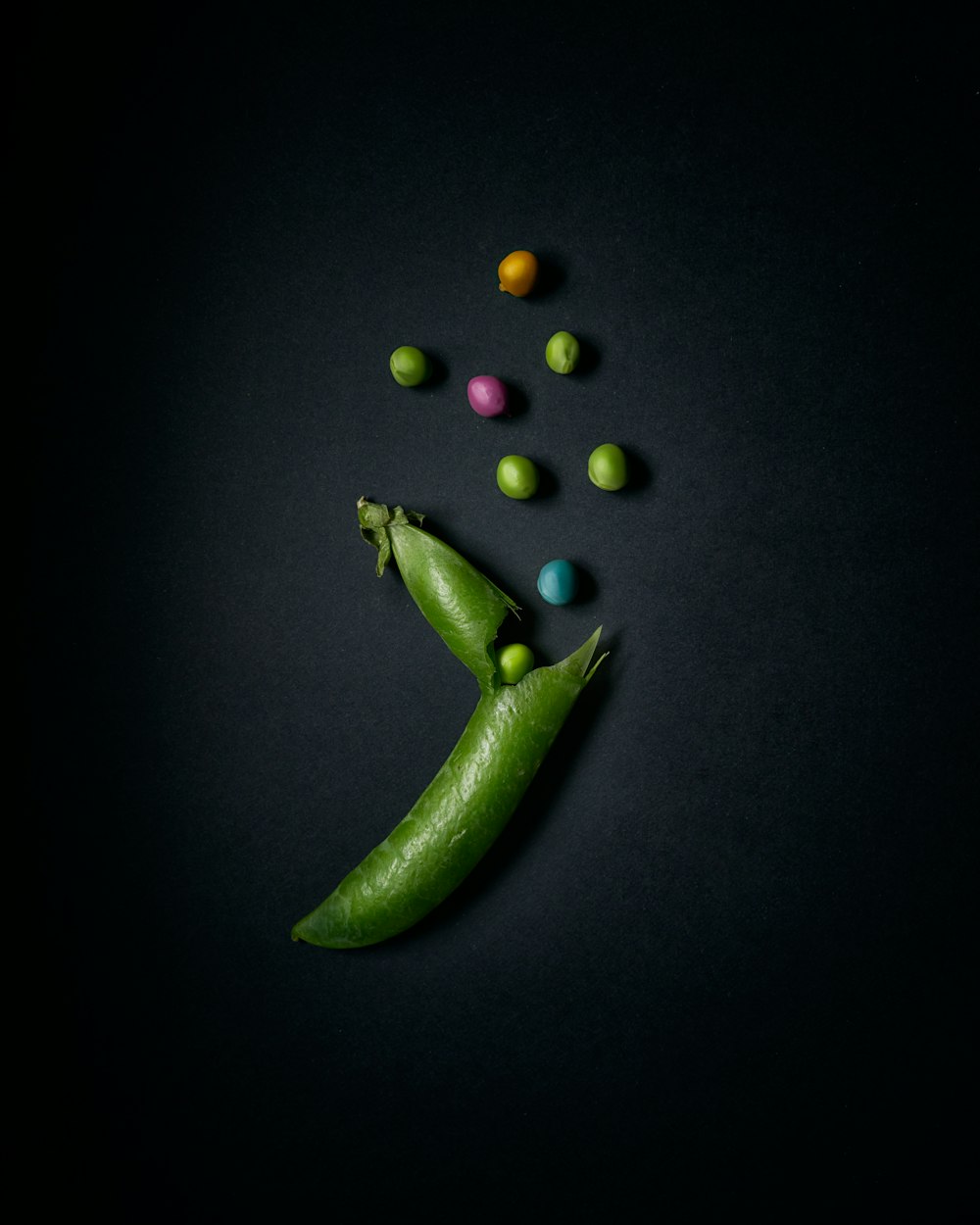 green chili pepper on black surface