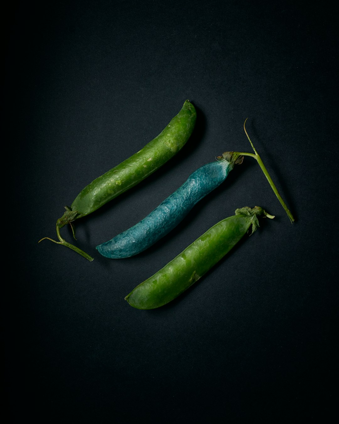 green vegetable on black surface