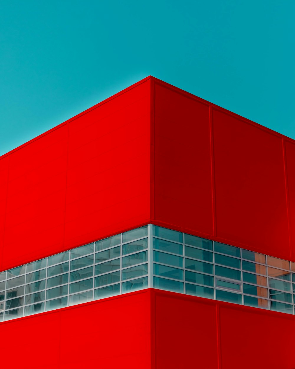 red and white building under blue sky during daytime