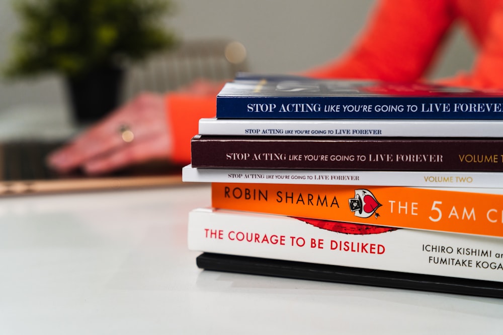 stack of books on white table