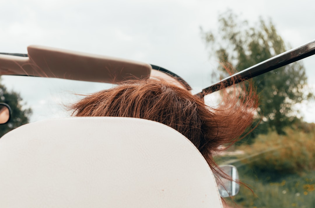 brown haired woman in white shirt