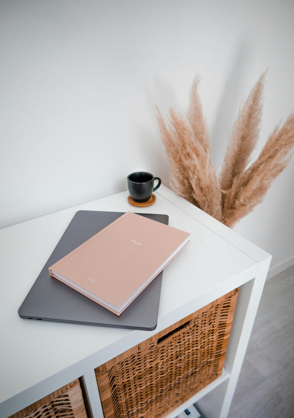 brown and black book on white table