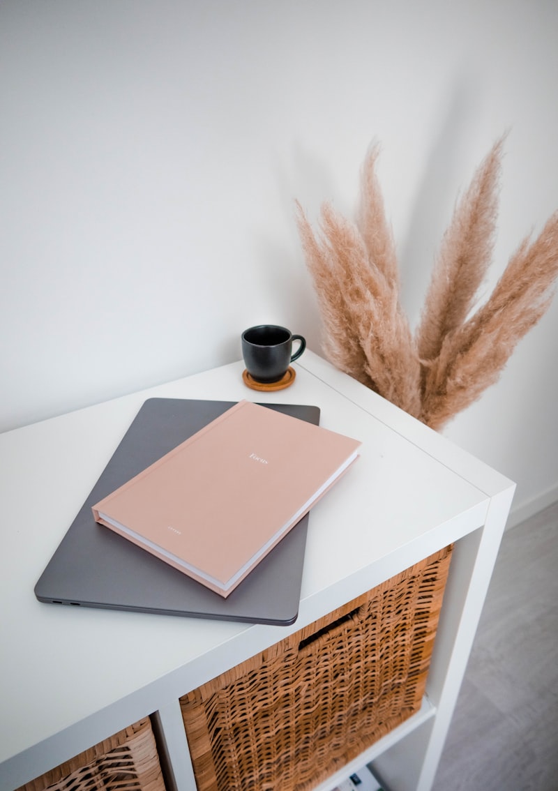 A small table with a book and tidy objects