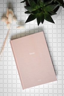 pink folder with green leaves