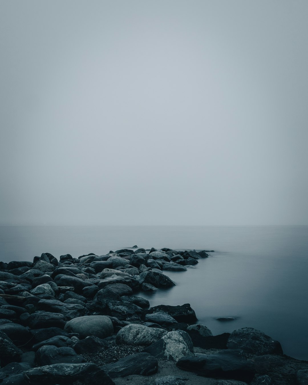 gray rocks on body of water